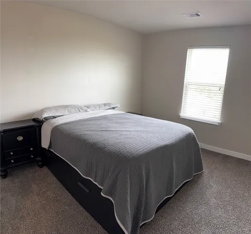 a bathroom with a granite countertop toilet a sink and bathtub