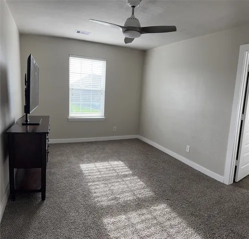 a view of a house with backyard and porch