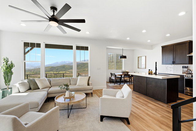 6039 North Westridge Road Heber City, UT 84032 - Photo 4 of 71 Spacious living area featuring large windows, wood-finish flooring, recessed lighting, and a modern ceiling fan
