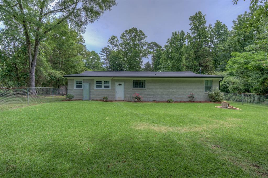 701 Chandler Road Haughton, LA 71037 - Photo 22 of 25 a view of house with backyard space and garden