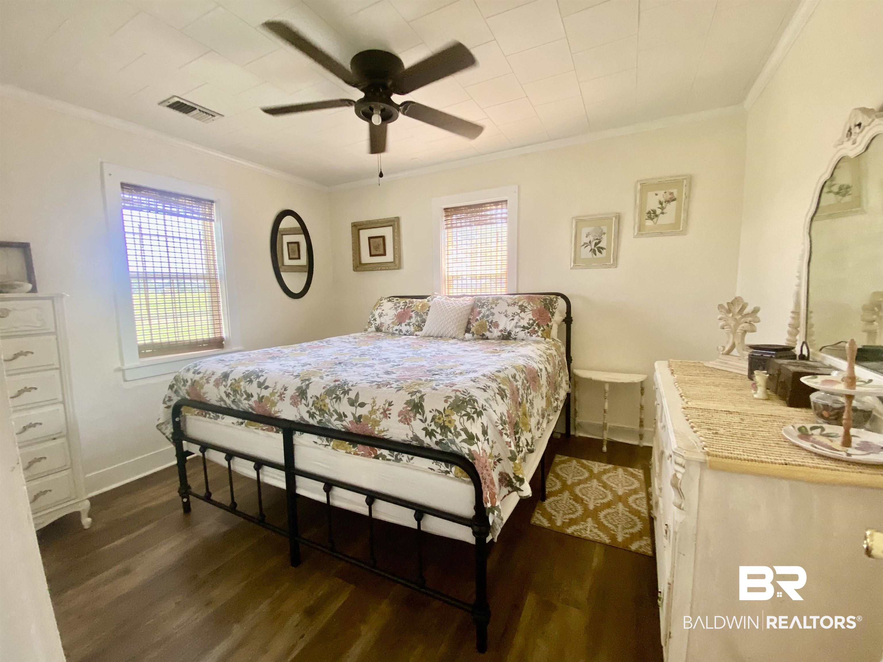 531 Highway 136 Monroeville, AL 36460 - Photo 34 of 48 Bedroom featuring dark wood-type flooring, ceiling fan, and multiple windows