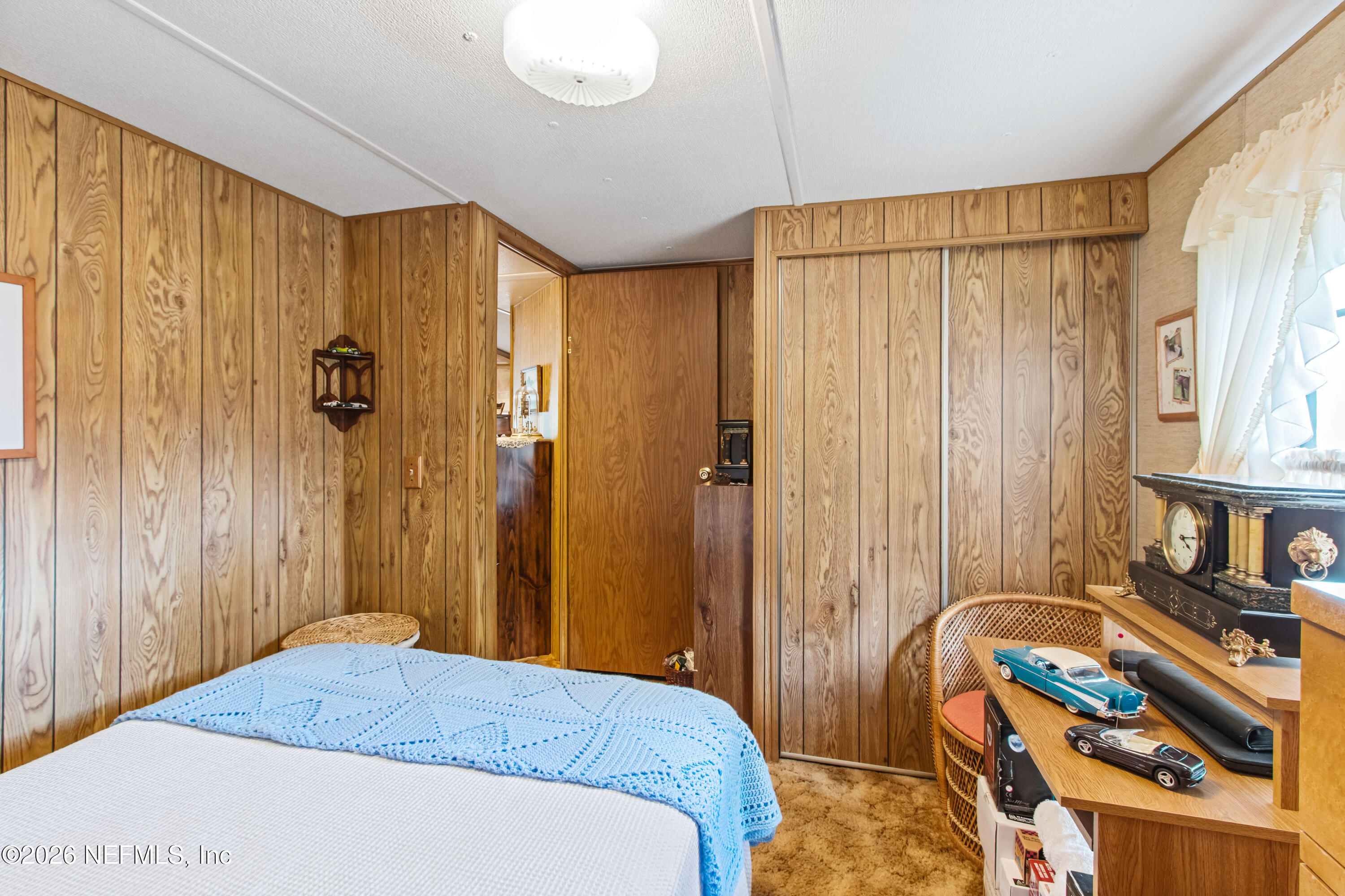 206 Anthony Avenue Interlachen, FL 32148 - Photo 20 of 32 a bedroom with a bed and a dresser