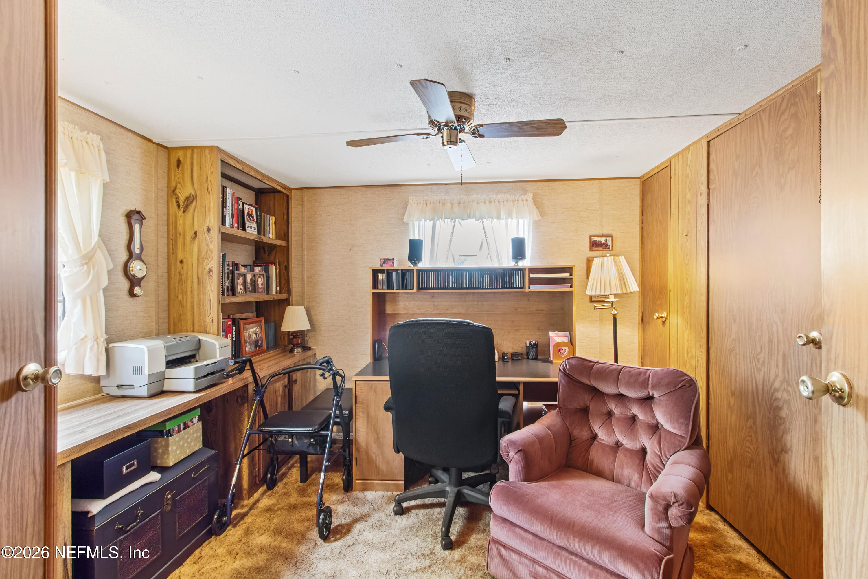 206 Anthony Avenue Interlachen, FL 32148 - Photo 21 of 32 a view of a livingroom with furniture and a window