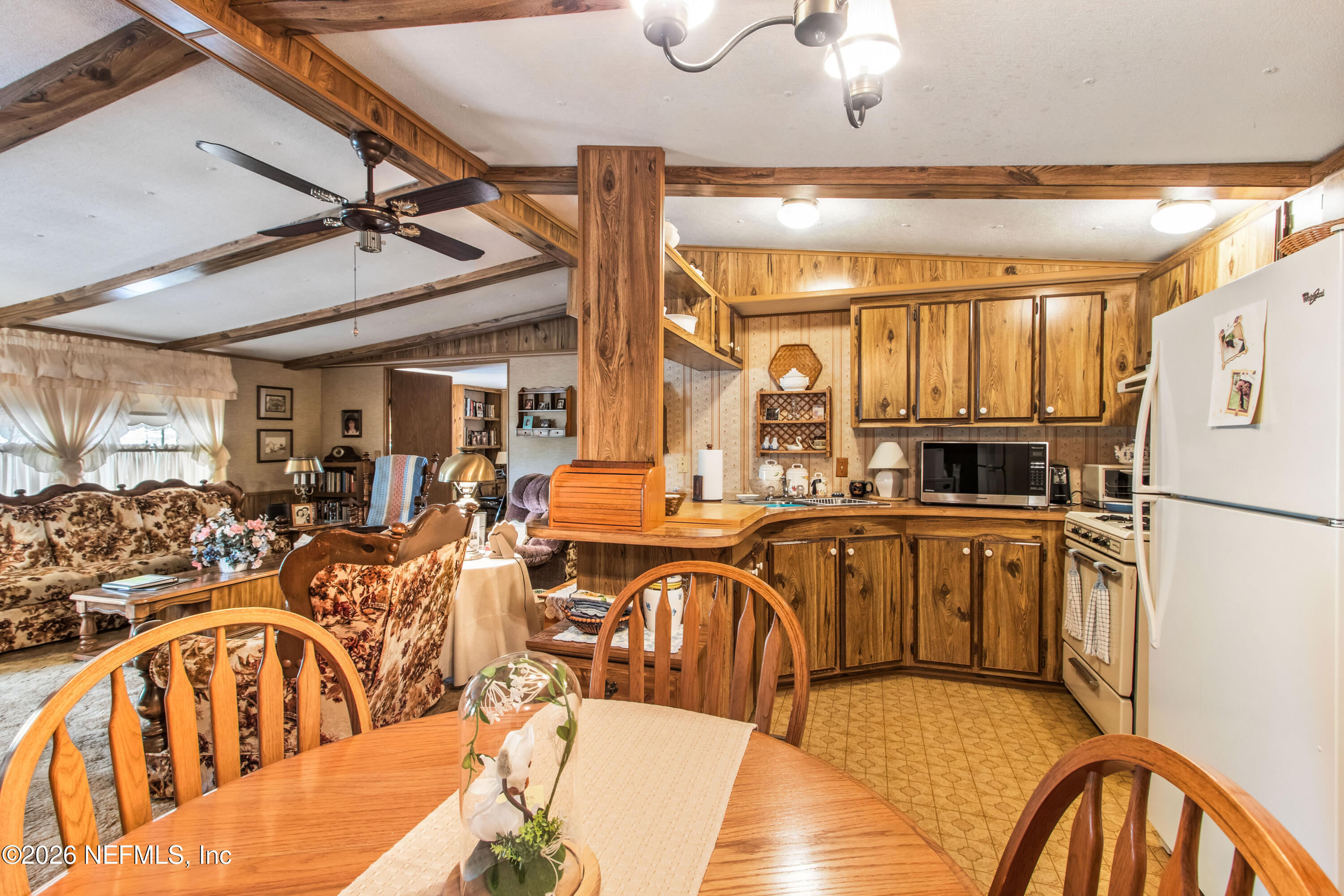 206 Anthony Avenue Interlachen, FL 32148 - Photo 23 of 32 a very nice looking dining room with a large window