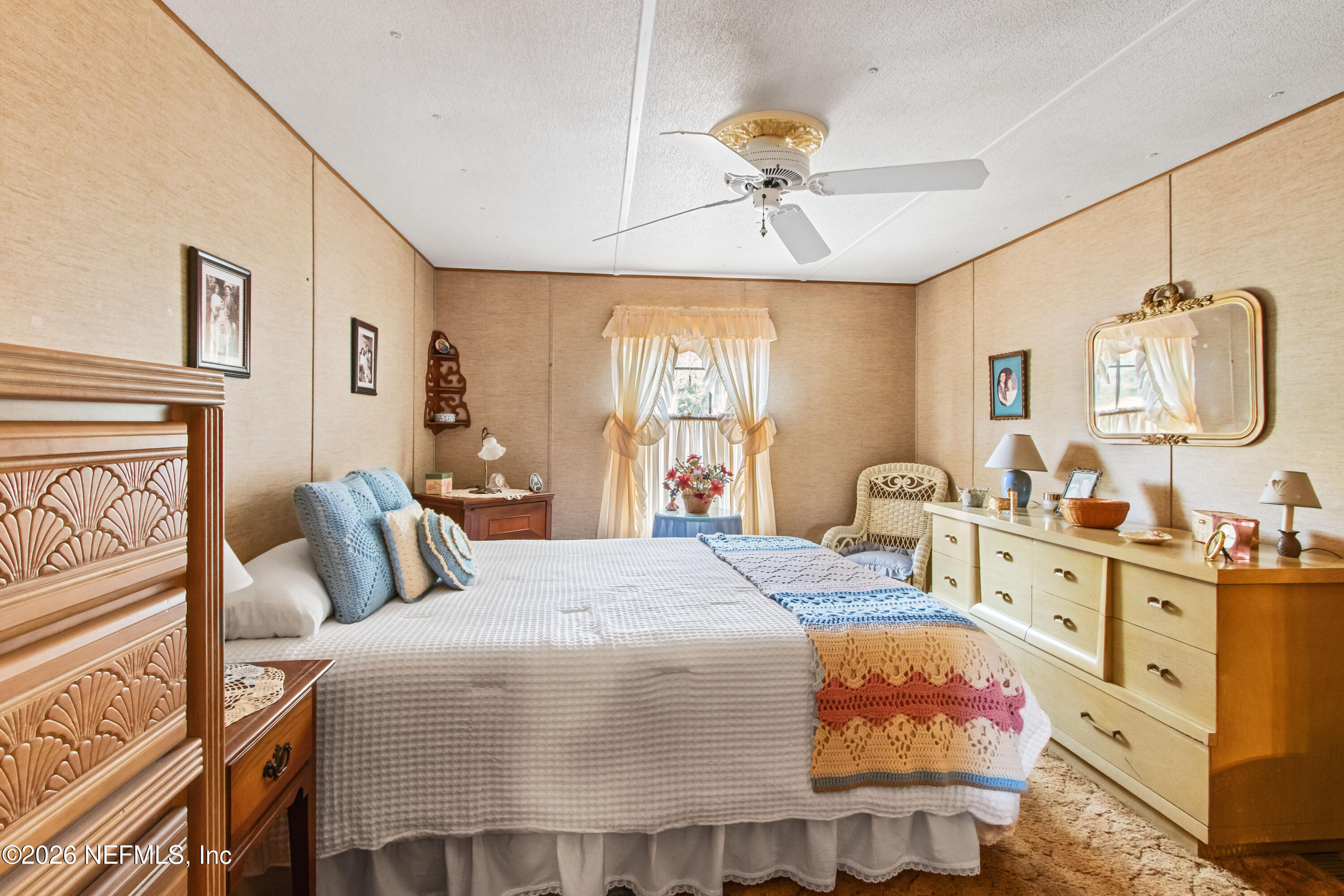206 Anthony Avenue Interlachen, FL 32148 - Photo 26 of 32 a bedroom with a bed and ceiling fan