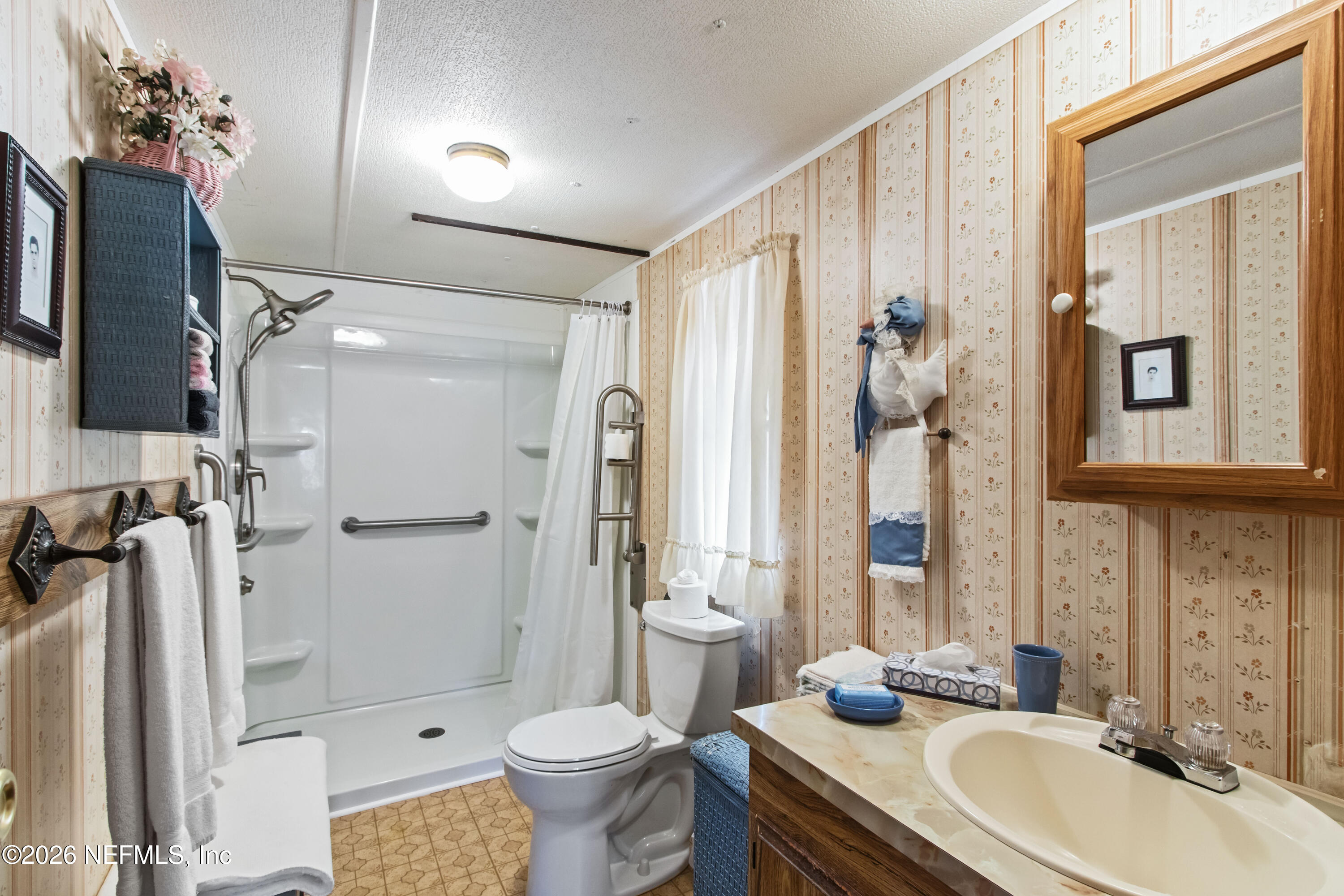 206 Anthony Avenue Interlachen, FL 32148 - Photo 28 of 32 a bathroom with a sink toilet and shower
