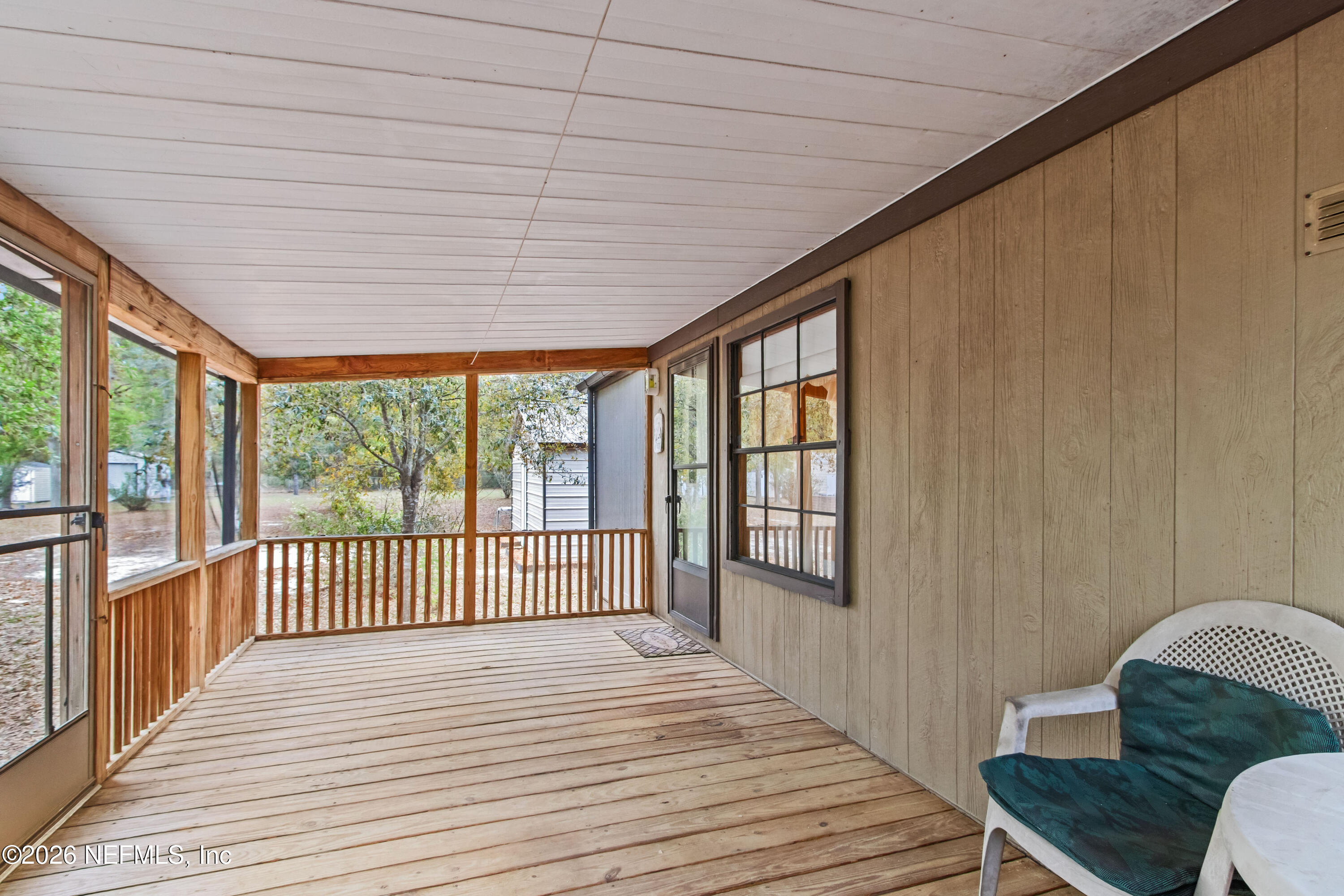 206 Anthony Avenue Interlachen, FL 32148 - Photo 4 of 32 a view of a balcony with wooden floor