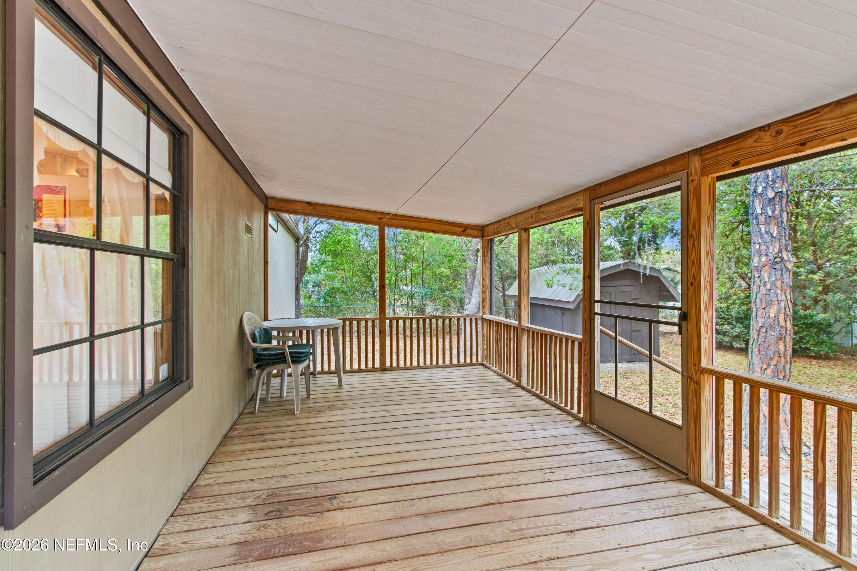 206 Anthony Avenue Interlachen, FL 32148 - Photo 5 of 32 a view of a balcony with wooden floor