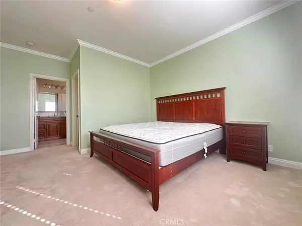 a living room with a bed and furniture