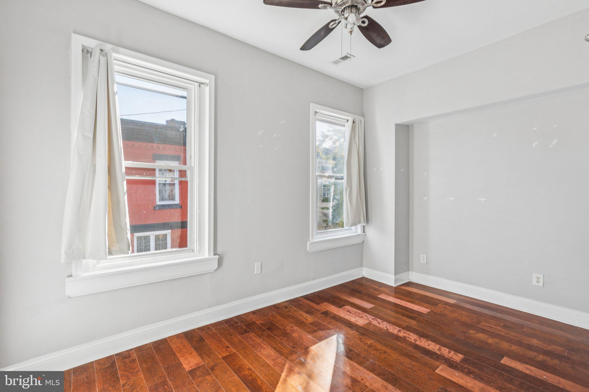1632 North Dover Street Philadelphia, PA 19121 - Photo 11 of 23 a bedroom with a bed and a window
