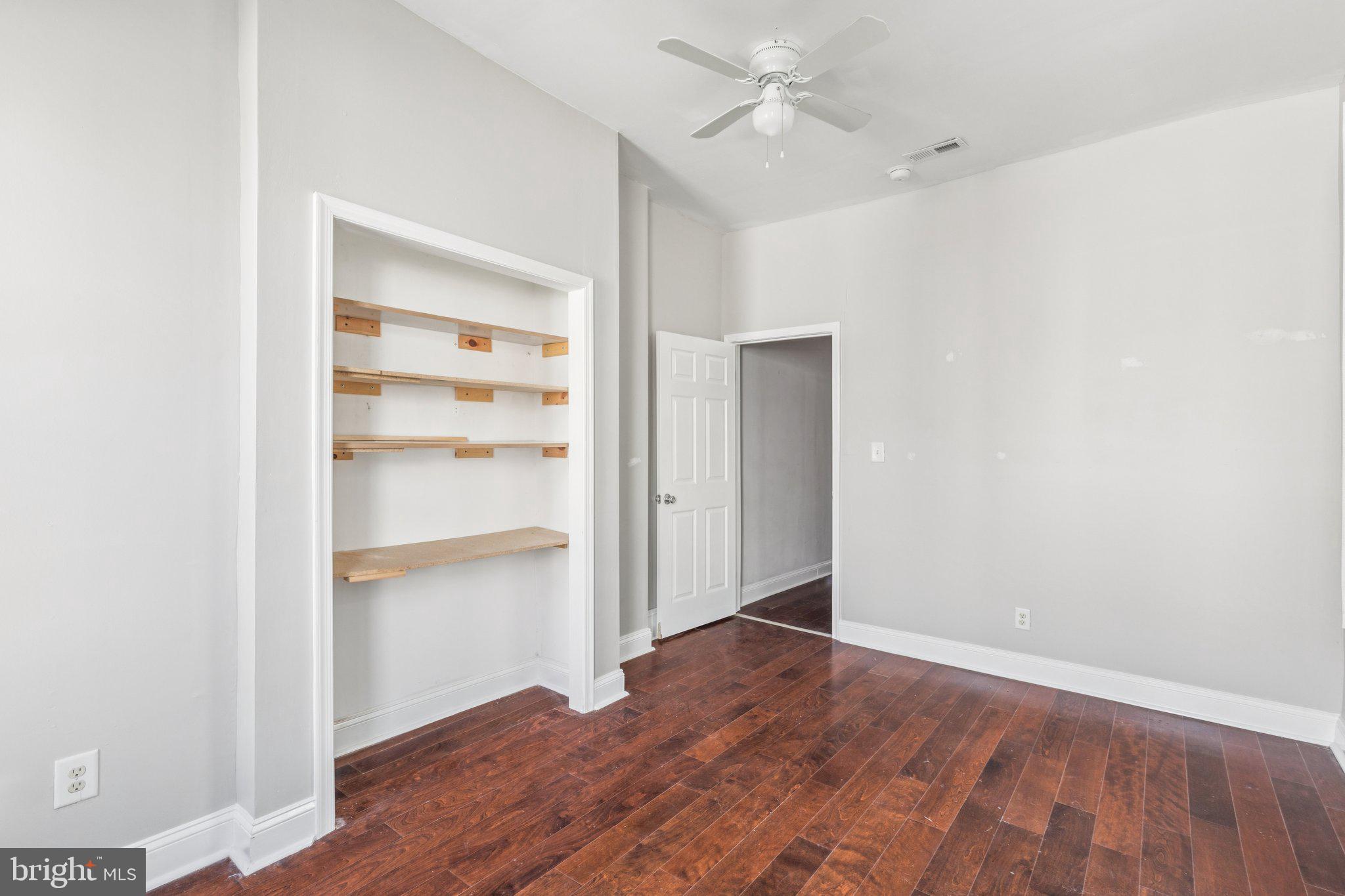 1632 North Dover Street Philadelphia, PA 19121 - Photo 13 of 23 a view of an empty room with a window and wooden floor