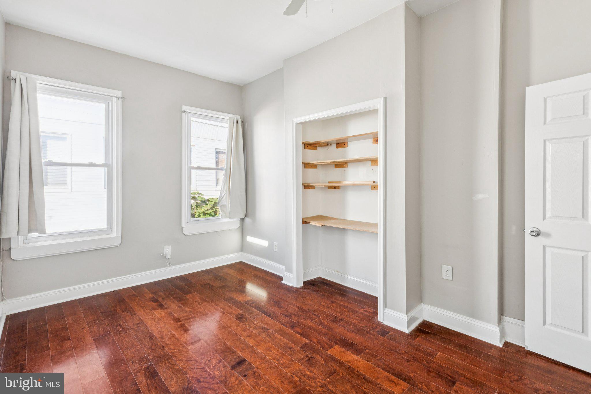 1632 North Dover Street Philadelphia, PA 19121 - Photo 14 of 23 an empty room with wooden floor closet and windows