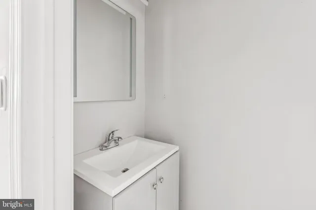a bathroom with a sink and vanity