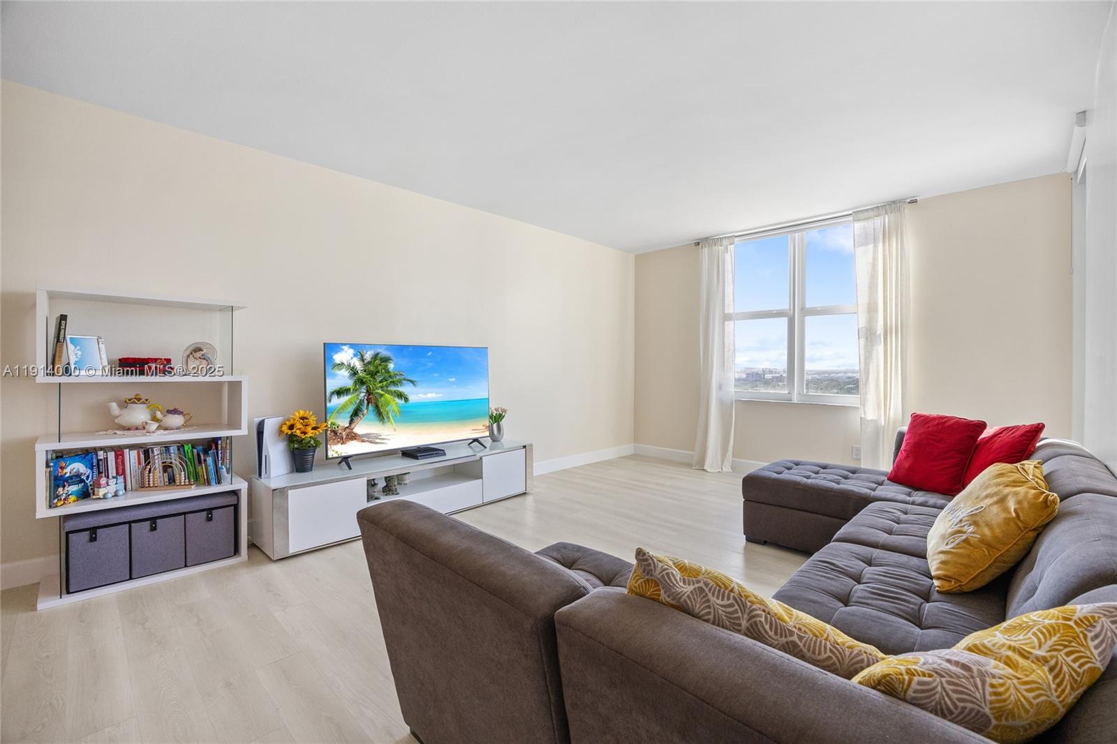 511 Southeast 5th Avenue, Unit 2209 Fort Lauderdale, FL 33301 - Photo 11 of 18 a living room with furniture and a flat screen tv