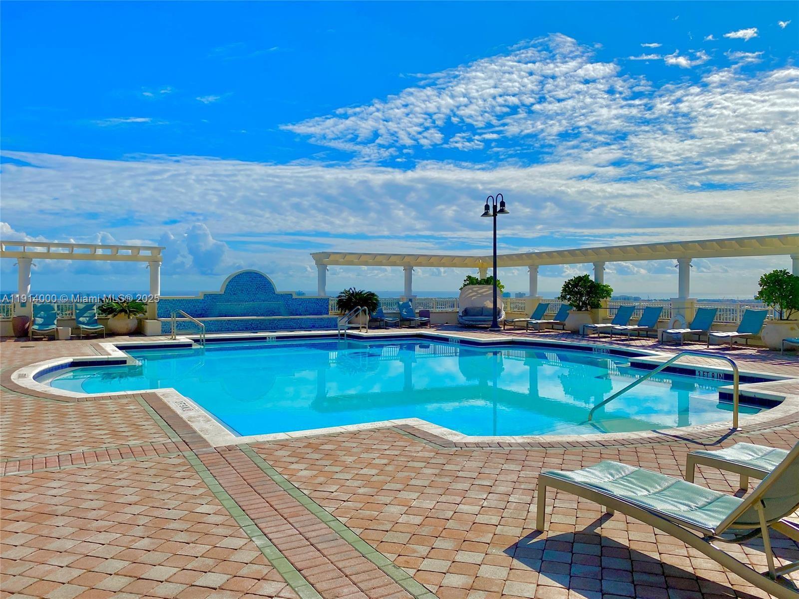 511 Southeast 5th Avenue, Unit 2209 Fort Lauderdale, FL 33301 - Photo 5 of 18 a view of a swimming pool with outdoor seating