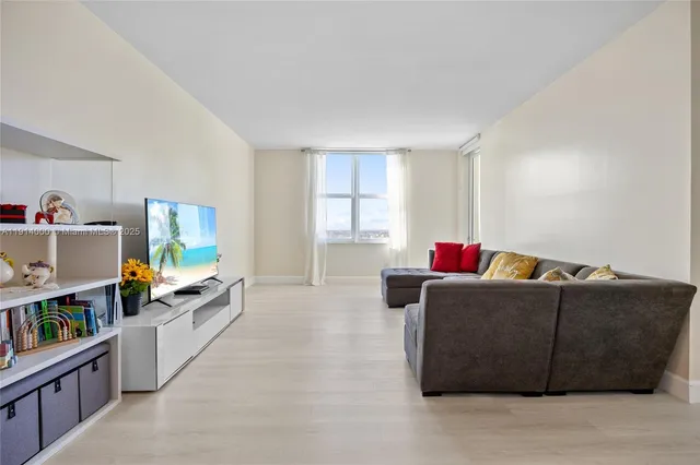 a living room with furniture and a window