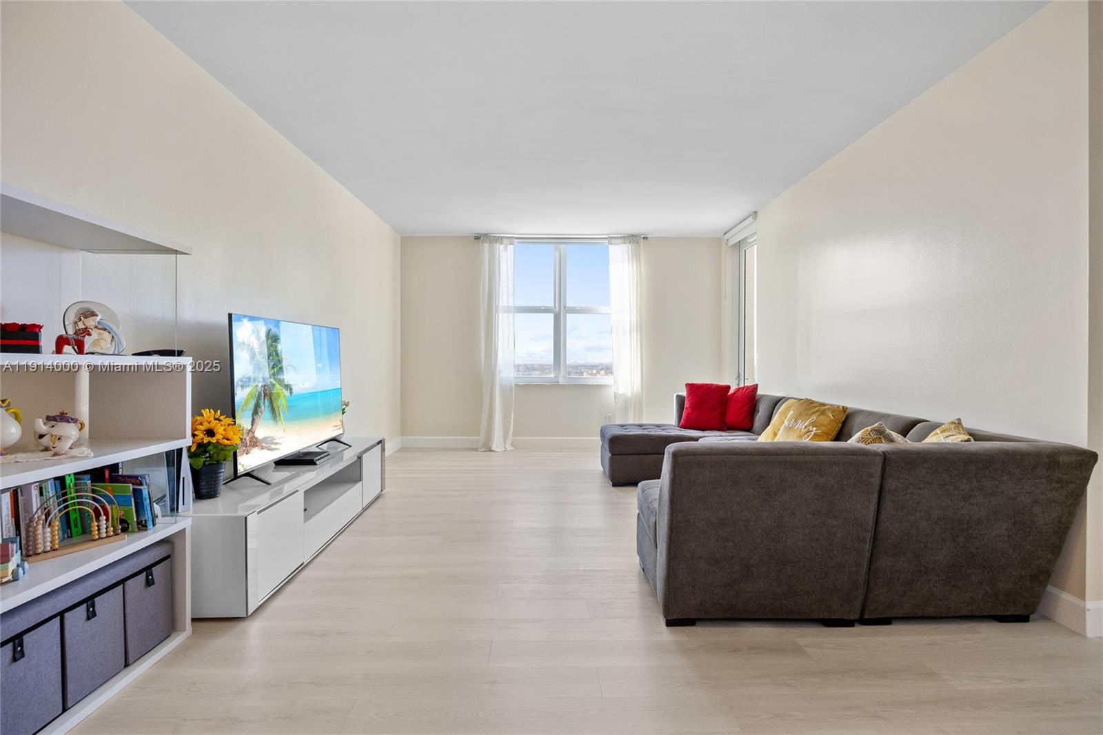 511 Southeast 5th Avenue, Unit 2209 Fort Lauderdale, FL 33301 - Photo 10 of 18 a living room with furniture and a window