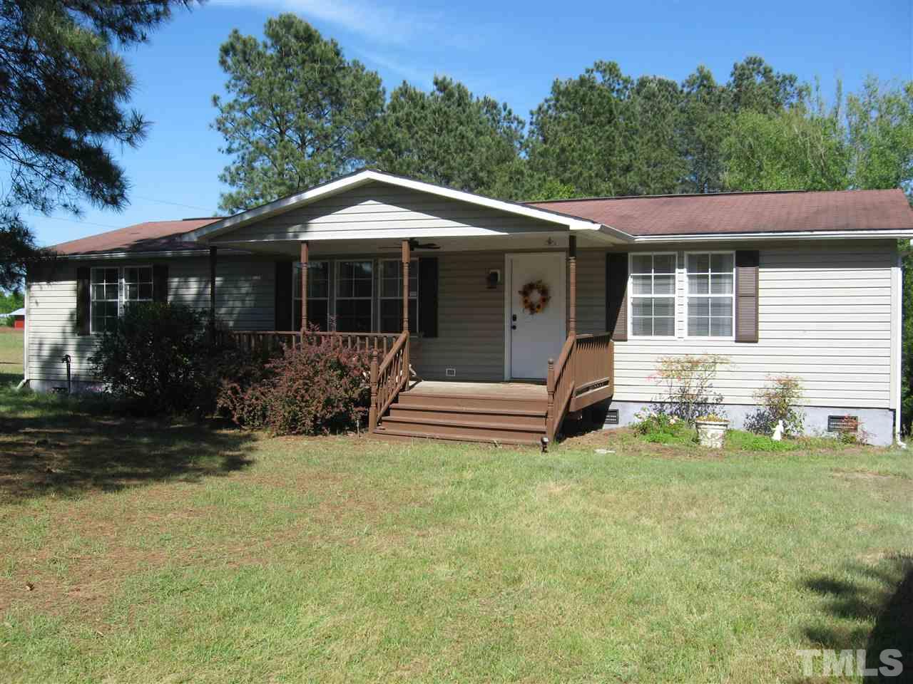 1445 L L Cooper Road Cameron, NC 28326 - Photo 1 of 25 a view of a house with a yard
