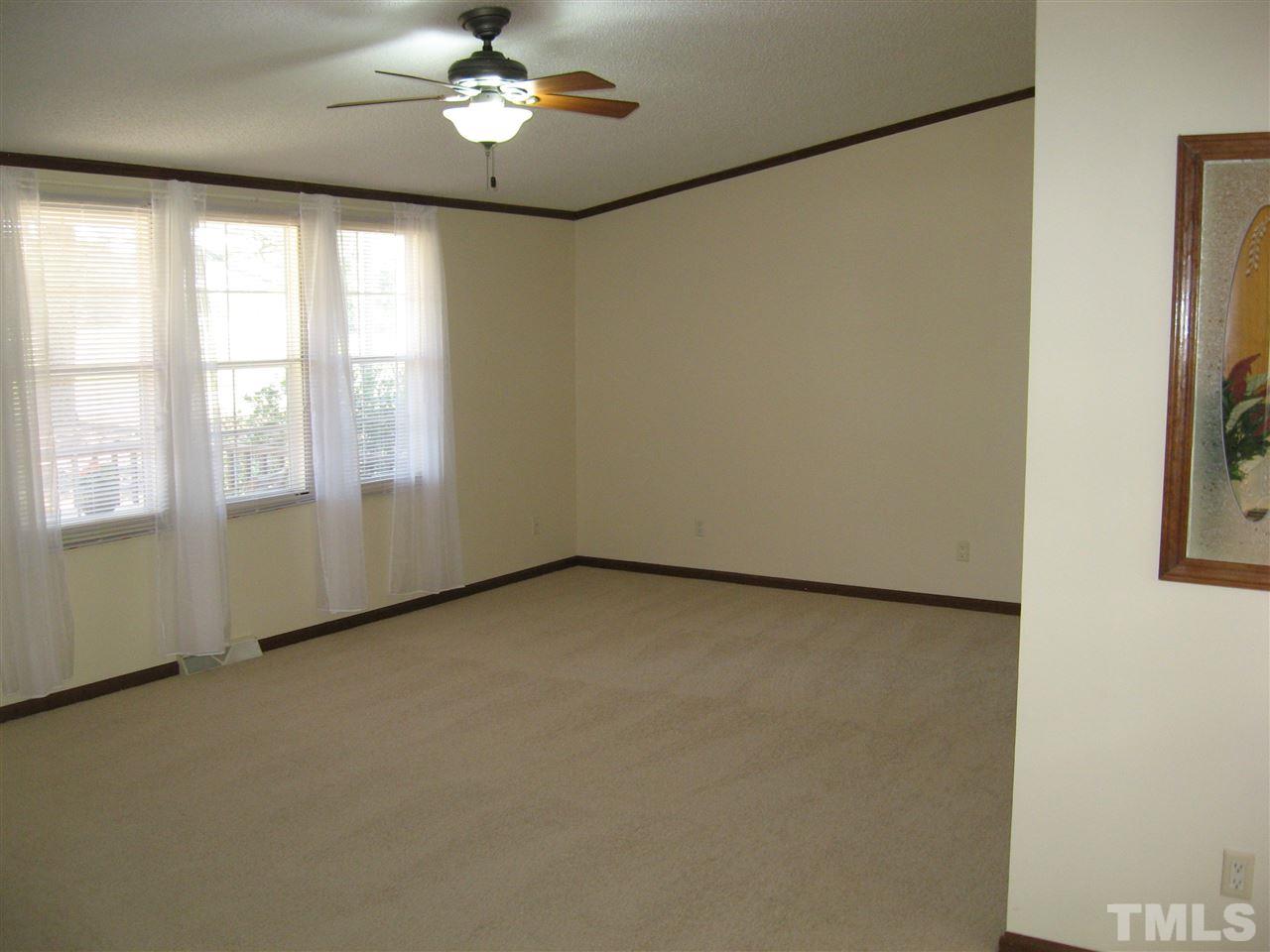 1445 L L Cooper Road Cameron, NC 28326 - Photo 3 of 25 a view of an empty room with a window