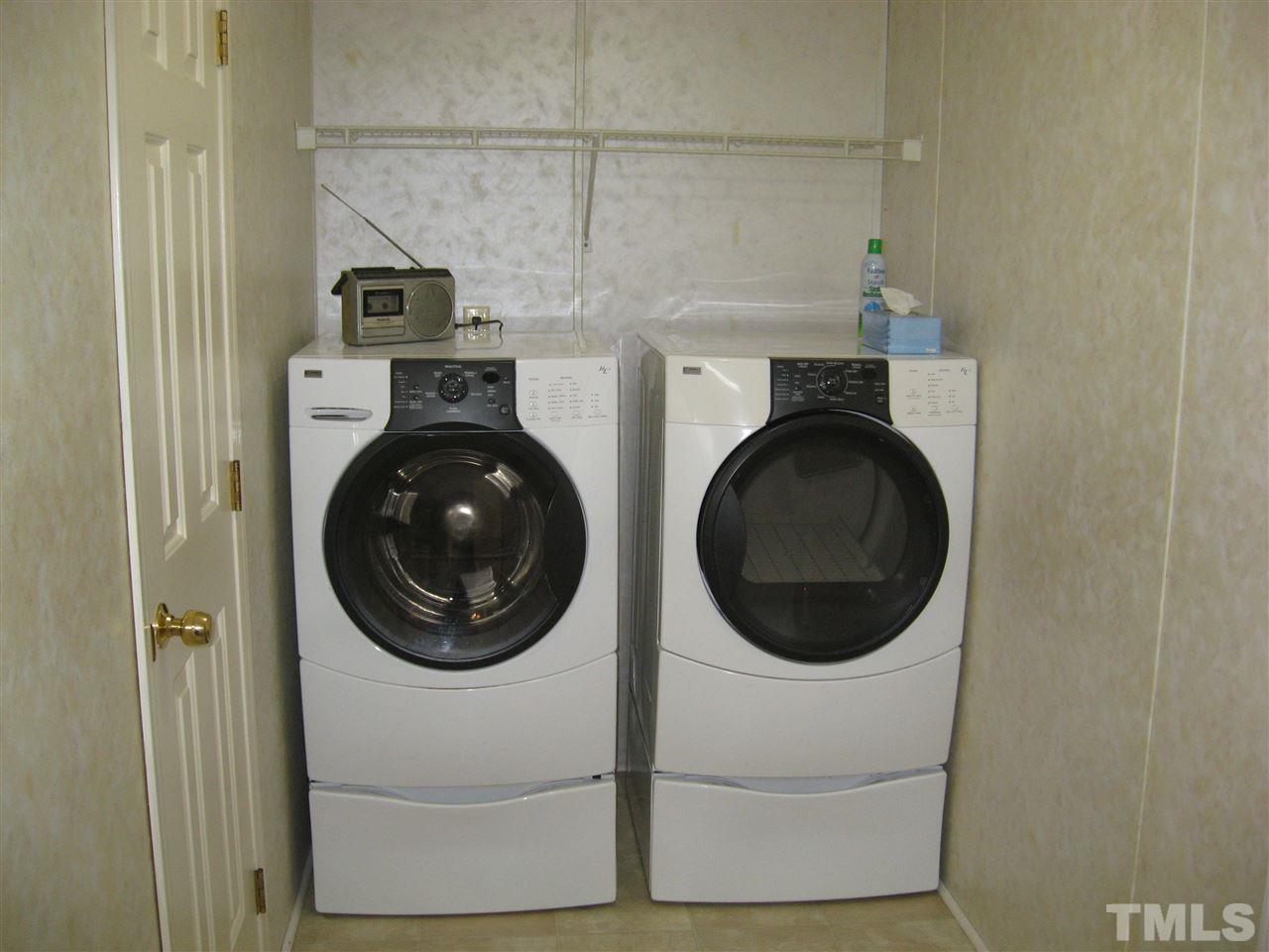 1445 L L Cooper Road Cameron, NC 28326 - Photo 7 of 25 a close view of a utility room with dryer and washer