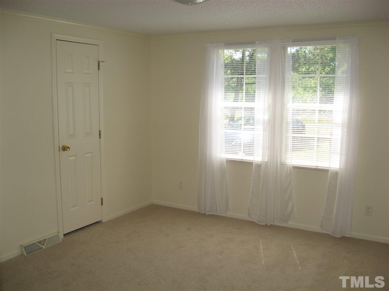 1445 L L Cooper Road Cameron, NC 28326 - Photo 8 of 25 an empty room with a window