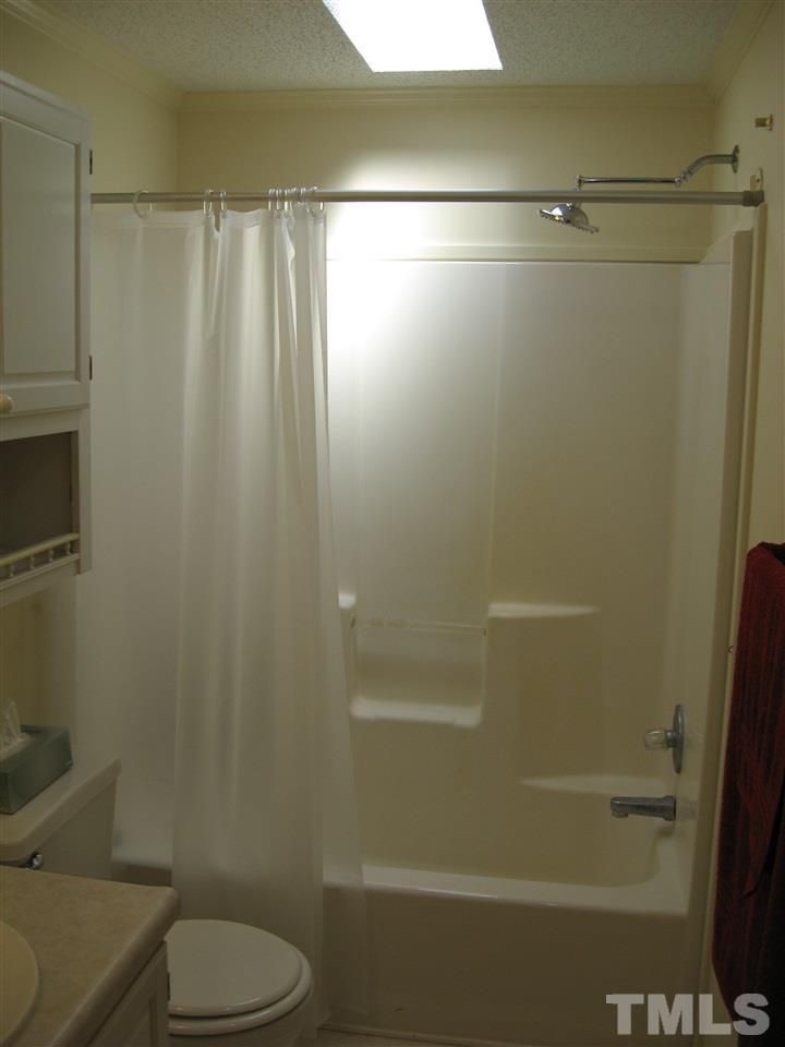1445 L L Cooper Road Cameron, NC 28326 - Photo 9 of 25 a bathroom with a shower and a toilet