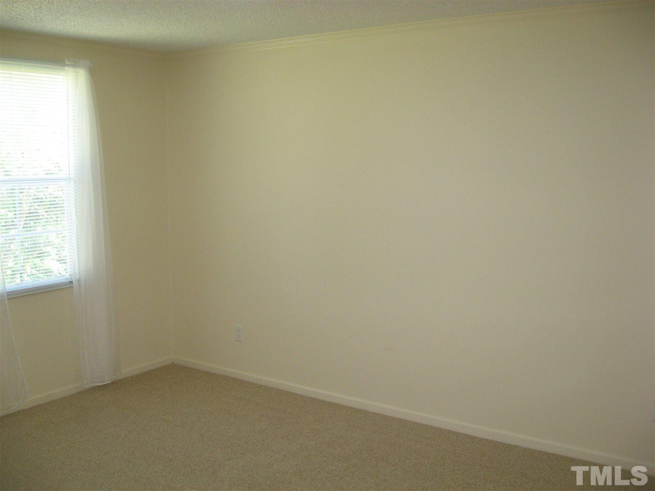 1445 L L Cooper Road Cameron, NC 28326 - Photo 10 of 25 an empty room with a window