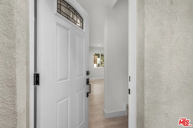 a view of kitchen with furniture and wooden floor