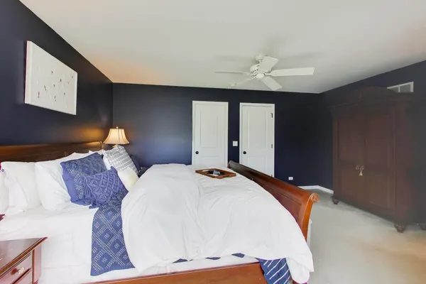 a bedroom with bed and window