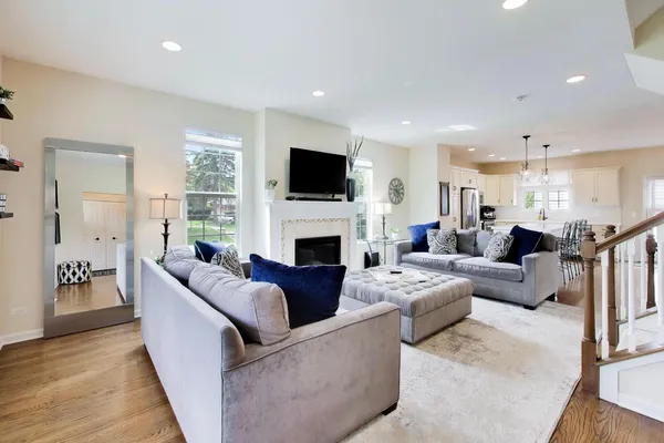 a living room with furniture flat screen tv and a fireplace
