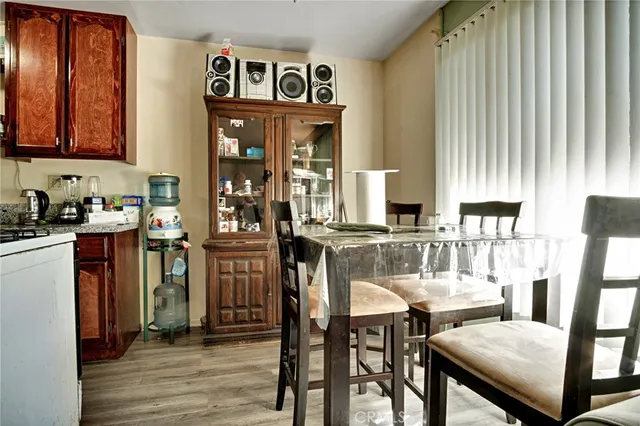 a view of a dining room with furniture and chandelier