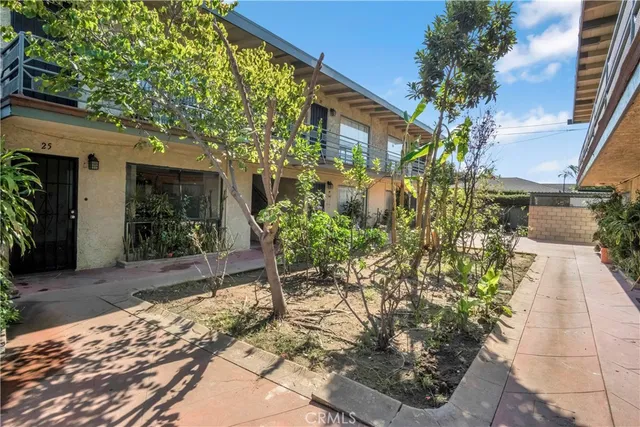 a couple of potted plants in front of door