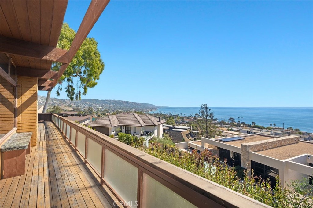 394 Pinecrest Drive Laguna Beach, CA 92651 - Photo 1 of 41 a view of roof deck with two chairs and wooden floor