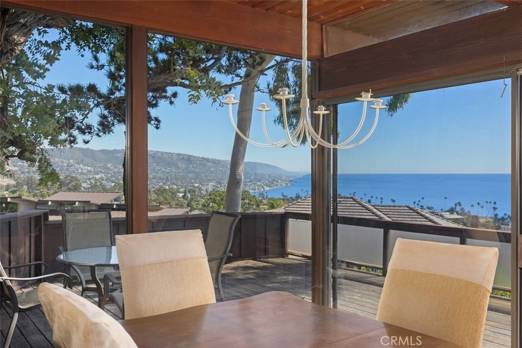394 Pinecrest Drive Laguna Beach, CA 92651 - Photo 9 of 41 a view of a patio with a table chairs and balcony