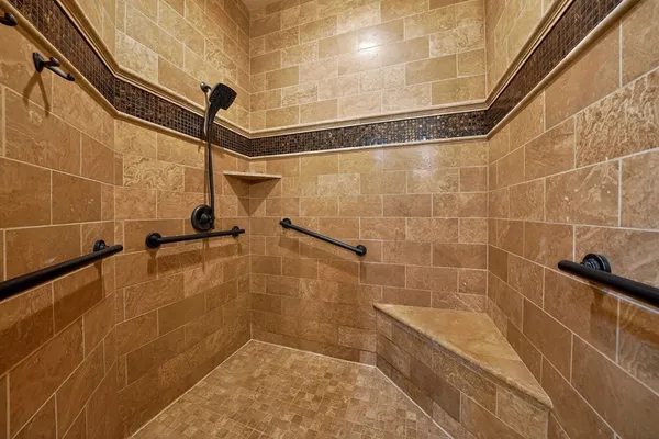 a spacious bathroom with a sink and a large mirror