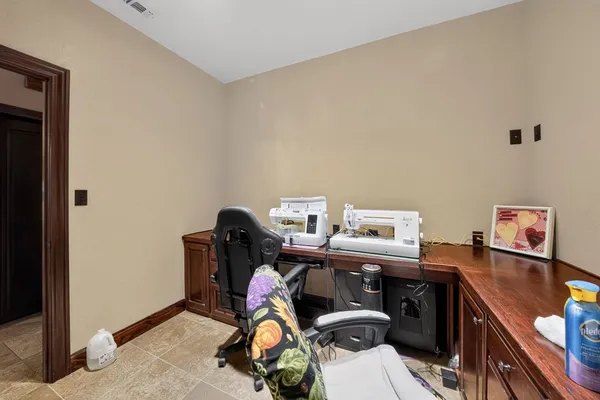 a bedroom with a bed furniture and a window