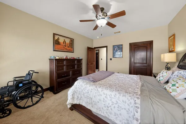 a bedroom with bed and window