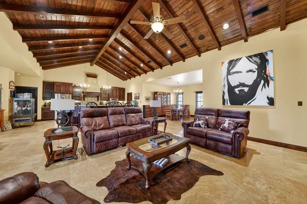 a living room with furniture and a clock