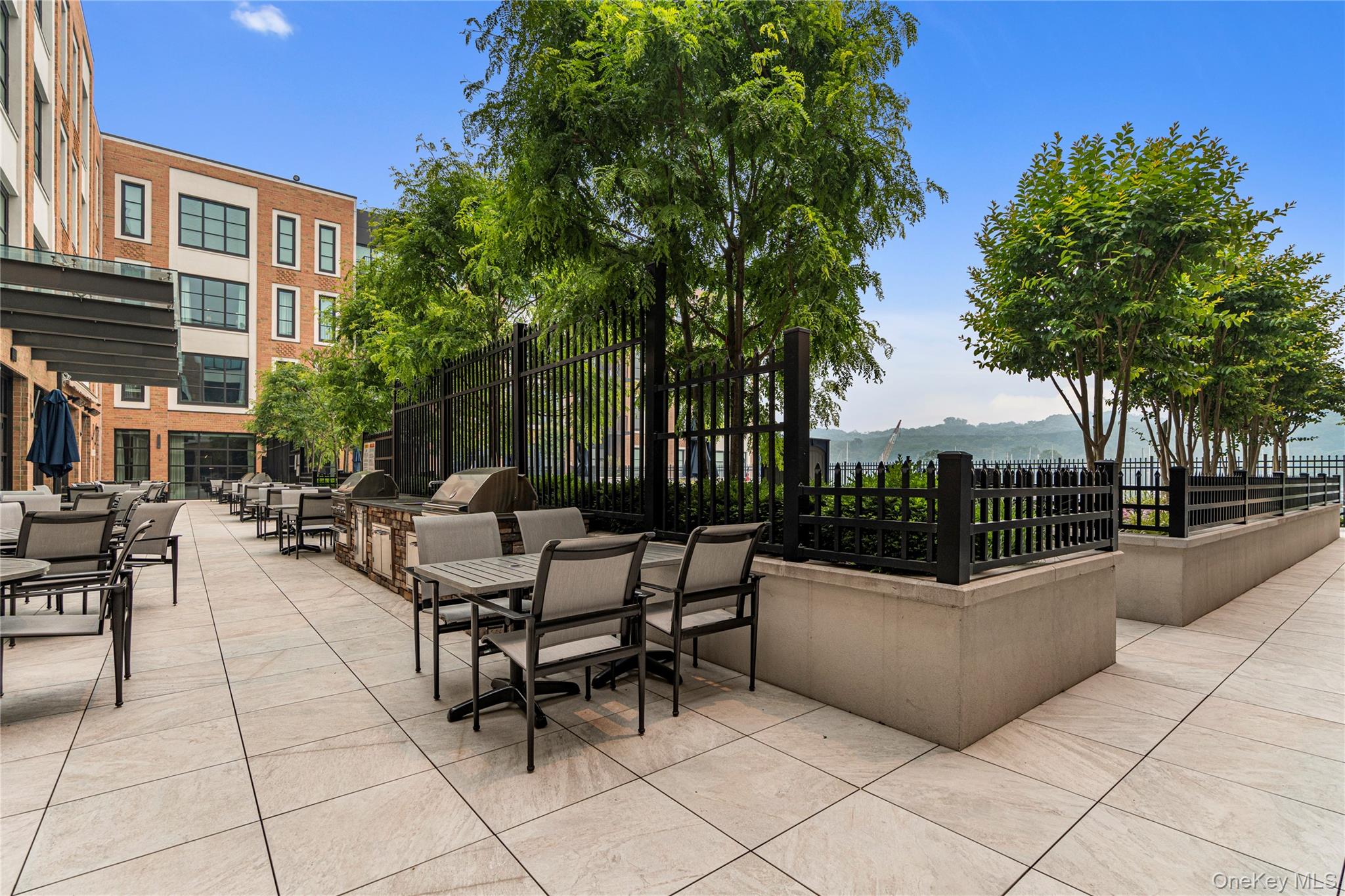 100 Garvies Point Road, Unit 1309 Glen Cove, NY 11542 - Photo 33 of 36 View of patio featuring outdoor dining area and area for grilling