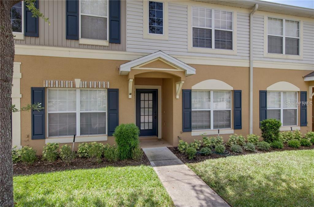 12342 Healey Summit Lane Riverview, FL 33579 - Photo 1 of 1 a view of a brick house with plants and large windows
