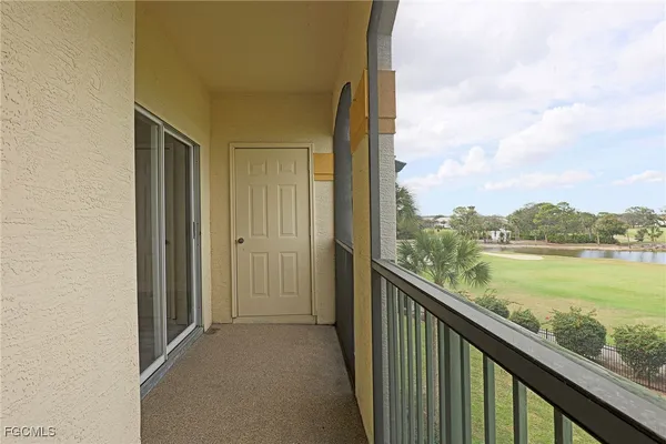 a view of a balcony with lake and mountain view