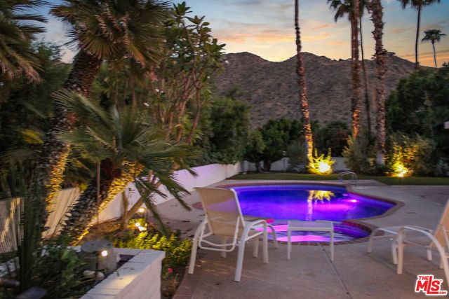 a view of a chairs and tables in the patio