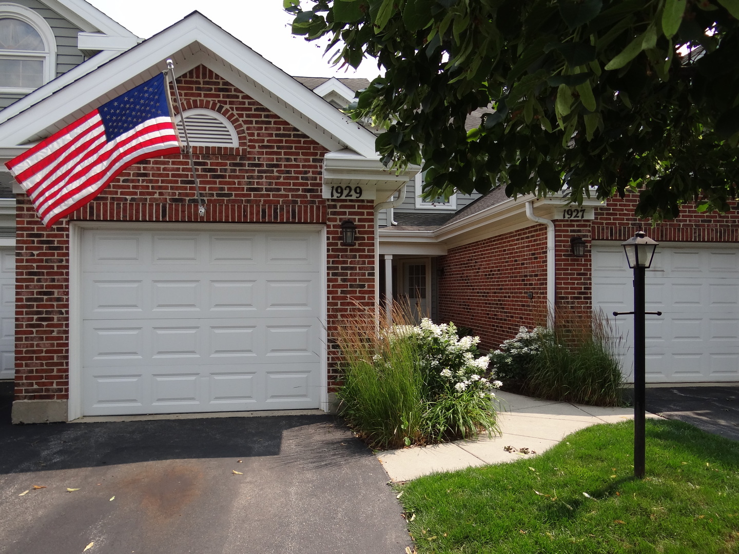 1929 Stillwater Road Arlington Heights, IL 60004 - Photo 1 of 29 a front view of a house with a yard