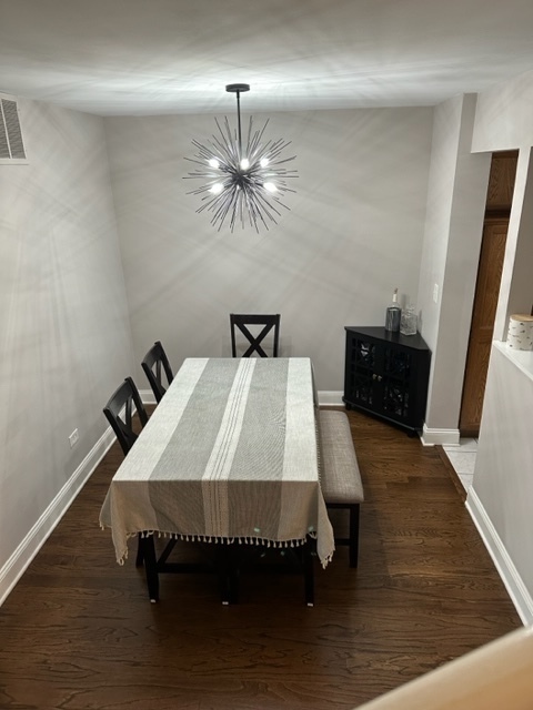 1929 Stillwater Road Arlington Heights, IL 60004 - Photo 5 of 29 a bed sitting in a bedroom next to a window