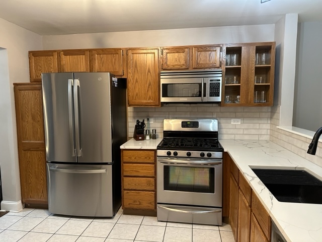 1929 Stillwater Road Arlington Heights, IL 60004 - Photo 9 of 29 a kitchen with a stove microwave and refrigerator
