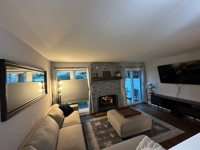 1929 Stillwater Road Arlington Heights, IL 60004 - Photo 10 of 29 a living room with furniture and a fireplace
