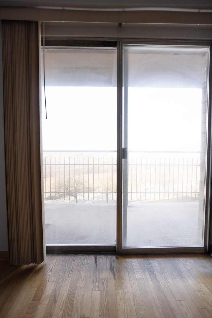 Undisclosed Address Chicago, IL 60645 - Photo 7 of 20 a view of an empty room and wooden floor and a window
