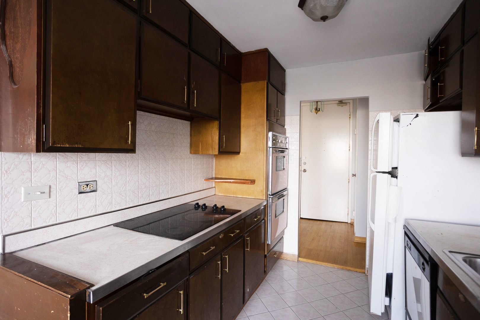 Undisclosed Address Chicago, IL 60645 - Photo 9 of 20 a kitchen with stainless steel appliances a stove a microwave and a refrigerator