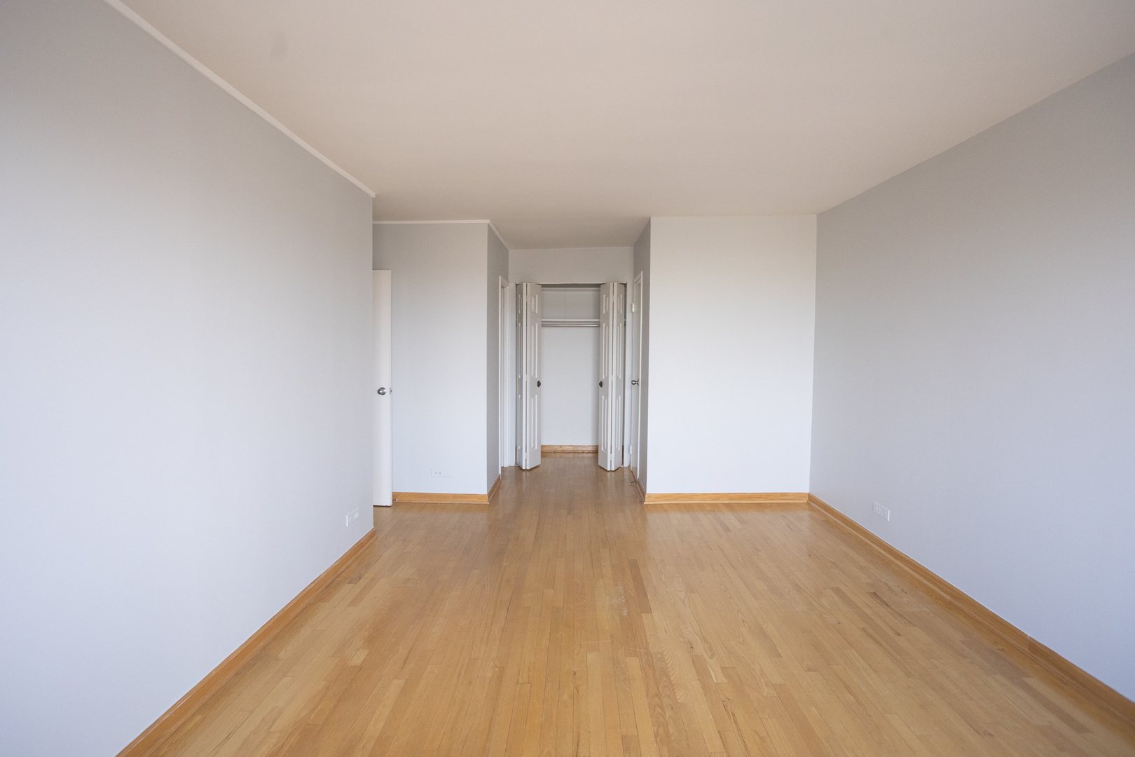 Undisclosed Address Chicago, IL 60645 - Photo 10 of 20 a view of an empty room with wooden floor