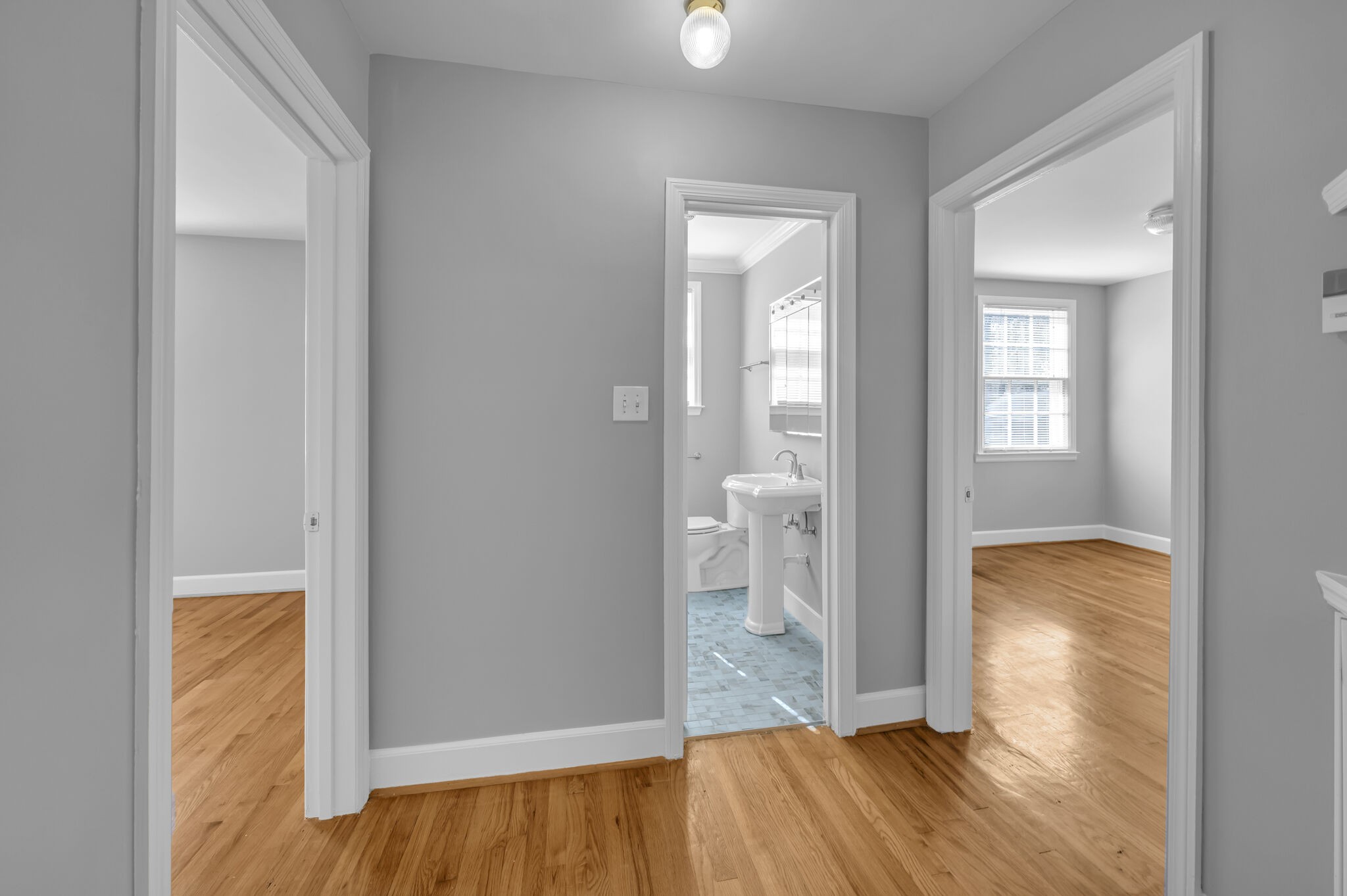 1231 Adams Street Franklin, TN 37064 - Photo 17 of 27 an empty room with wooden floor and a bathroom